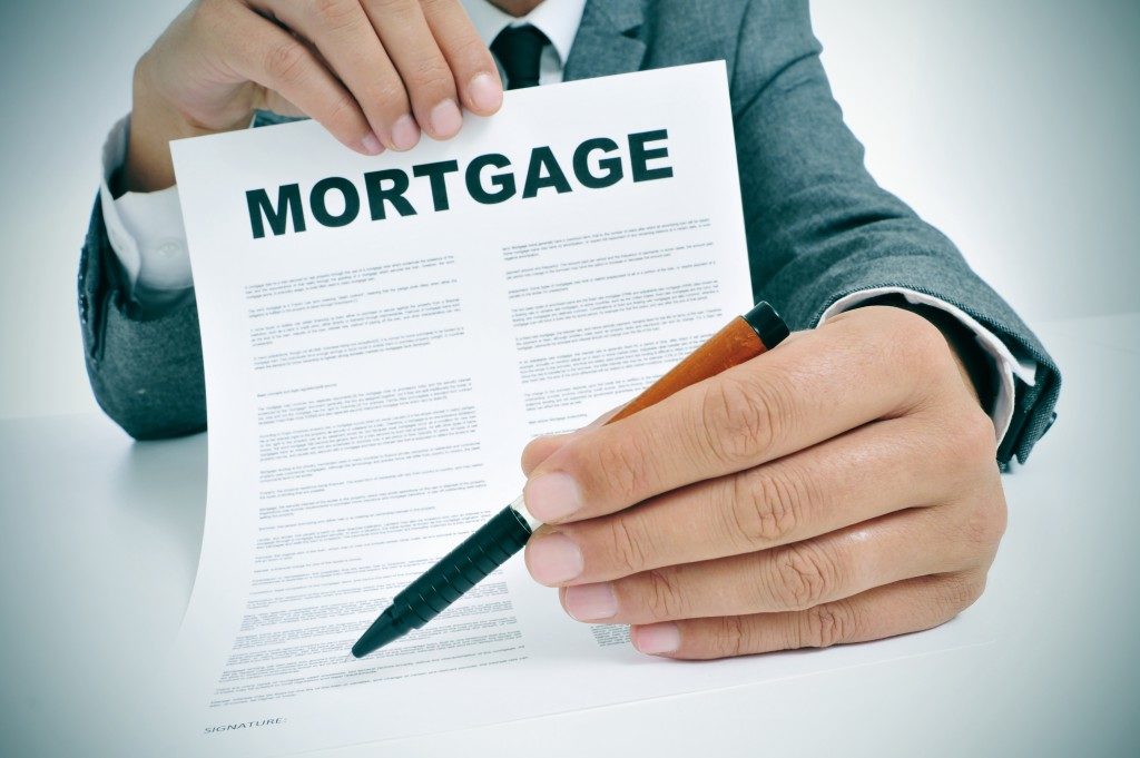 Man holding a mortgage contract